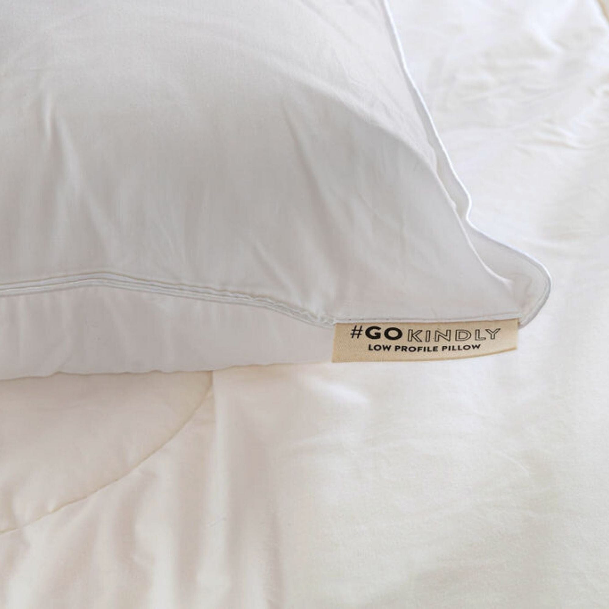 Low profile pillow on bed close up